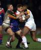 John Morris tries to wrestle free from a few Bulls.