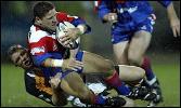 Robbie O'Davis is tackled by Mike Forshaw.