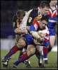 Robbie O'Davis is swamped by Bradford tacklers.