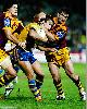 Country captain Andrew Johns makes a tackle.