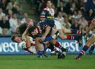 Reegan Tanner is tackled.