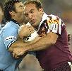 The captains collide: Andrew Johns tackles Gorden Tallis