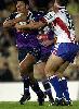 Steven Kearney is tackled.
