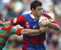 Timana Tahu puts a fend on.