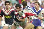 Adrian Morley is tackled by Andrew Price.