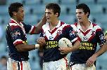 Some Roosters celebrate another try.