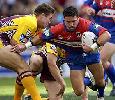 Robbie O'Davis is nearly through a tackle.