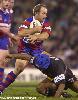 Adam MacDougall fends off a Panther.