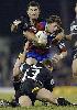 Kurt Gidley is tackled.