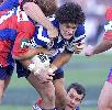 Willie Mason is tackled.