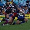 Hasim El Masri is just about tackled into touch.