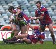 Troy Thompson is tackled ...