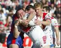 Mark Riddell is thumped by Steve Simpson.