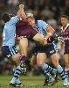 Danny Buderus and Craig Fitzgibbon make a tackle.