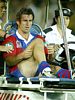 Andrew Johns is loaded onto the minicart ...