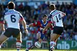 Kurt Gidley puts another great attacking kick through.