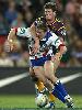 Craig Frawley pulls down Kurt Gidley.