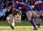 Kurt Gidley makes a smashing tackle.