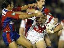 Mark Riddell is wrestled to the turf.