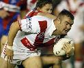 Kurt Gidley tackles Mark Riddell.
