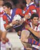 Kurt Gidley has Trent Barrett clinging on for dear life.
