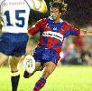 Andrew Johns, returning from his 2003 neck injury, punts downfield.