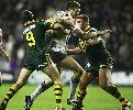Danny Buderus and Shane Webcke go in to tackle Jamie Peacock.