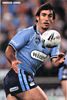 Andrew Johns runs onto a pass.