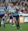Andrew Johns passes to support.