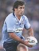 Andrew Johns with what appears to be a dummy.