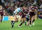 Andrew Johns about to throw a one-handed pass.
