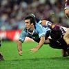 Andrew Johns offloads from Corey Parker's tackle.
