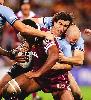 Andrew Johns and Craig Fitzgibbon take care of Petero Civoniceva.