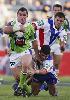 Luke Quigley tries to tackle a rampant Josh Miller.