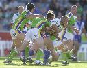 Kirk Reynoldson drags a few Canberra defenders with him.