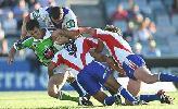 Clinton Schifcofske is driven to the turf by three Knights defenders.