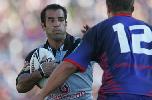 Stacey Jones about to try and fend Steve Simpson.