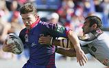 Matthew Gidley tries to beat the tackle of Stacey Jones.