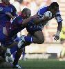 Roy Asotasi is caught from behind.
