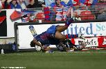 Milton Thaiday does brilliantly to get the ball down for his first Newcastle try.