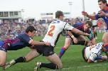 Glamour boy Scott Minto reaches out to score.