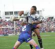 Justin Hodges offloads a pass.