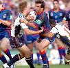 Andrew Johns gets shut down.
