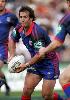 Andrew Johns holds up a pass.