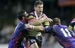 Luke Ricketson is squashed by Luke Quigley and Clint Newton.