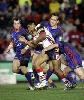 Iosia Soliola is dragged down.