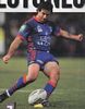 Andrew Johns shoots for goal.