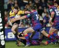 Adam Woolnough makes a tackle.
