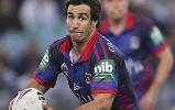 Andrew Johns about to pass.