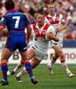 Shaun Timmins tries to put the moves on Andrew Johns.